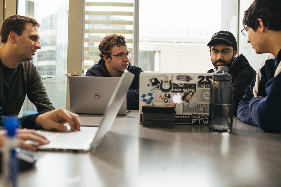 CS graduate students working on software programming