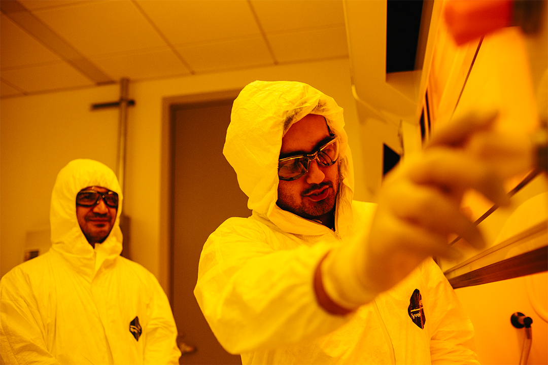 Students conducting experiments in the nanofabrication clean room of the Science and Engineering Hall.