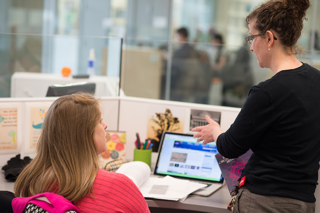 Professor working with student on systems engineering research